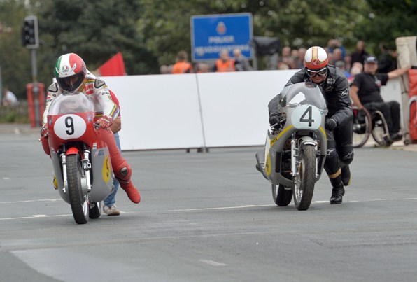 Giacomo Agostini and John McGuinness set off on the Isle of Man Steam Packet Company ’67 Senior TT Re-enactment, one of the highlights of the Classic TT